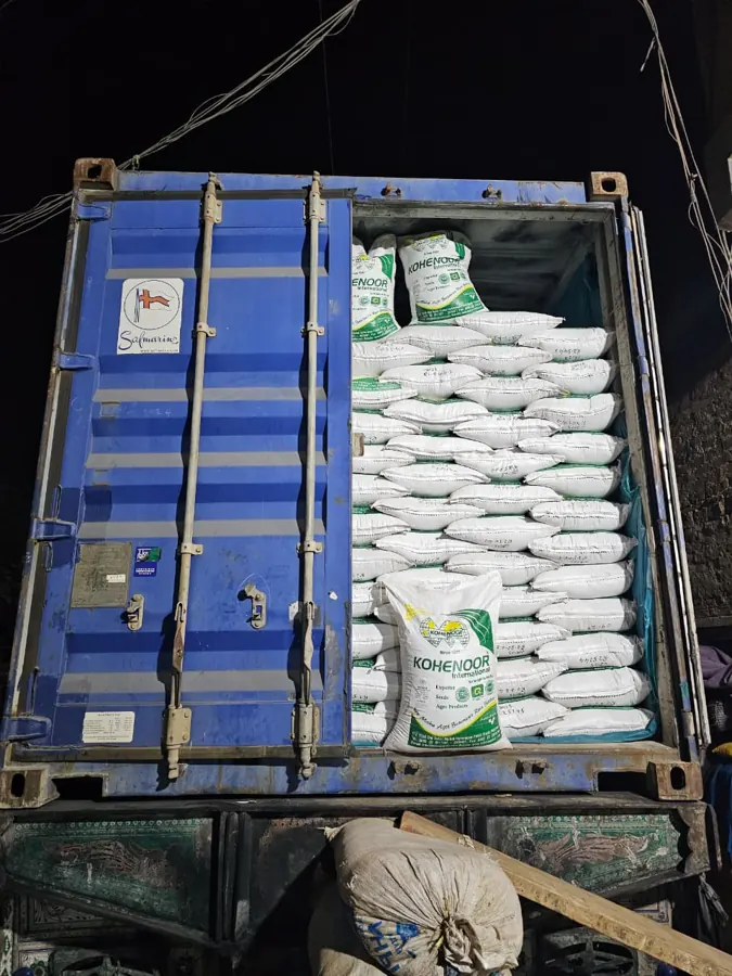 Container floor lined and desiccant placed before loading seed bags